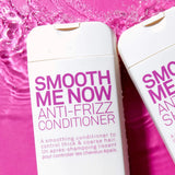 Two bottles of Eleven Smooth Me Now Anti-Frizz Conditioner' on a pink background with water droplets.