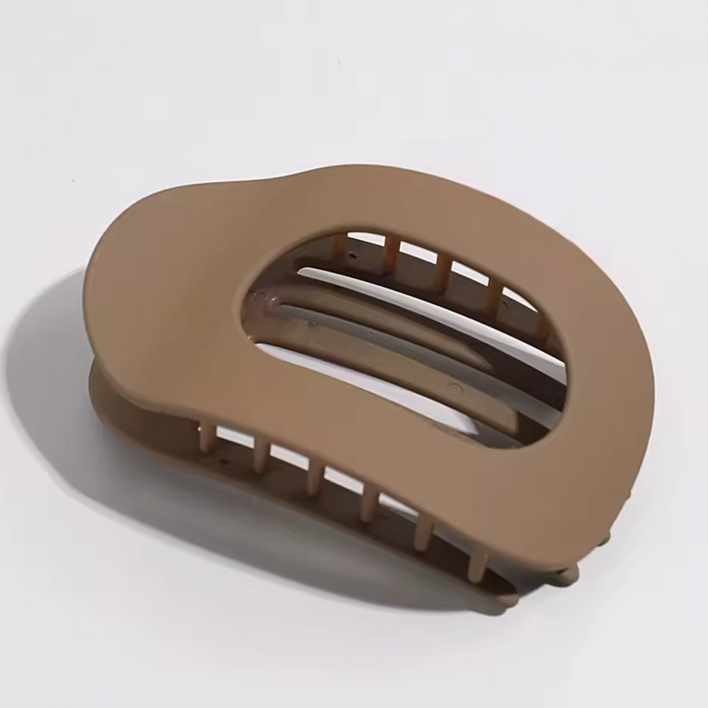 Brown hair clip on a white background