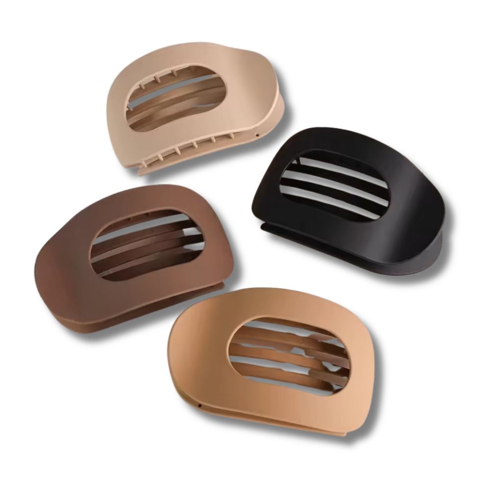 Four hair clip bases in beige, brown, and black on a white background
