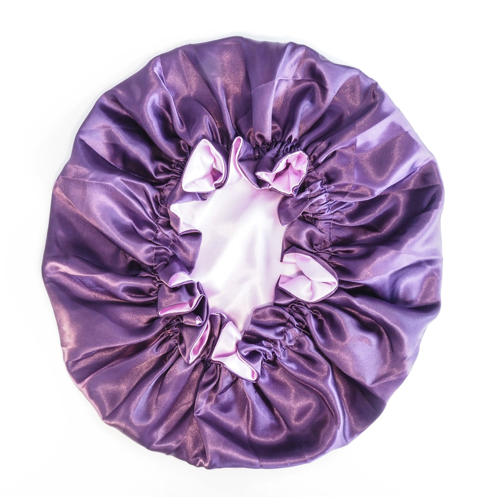 Purple satin sleeping bonnet on a white background