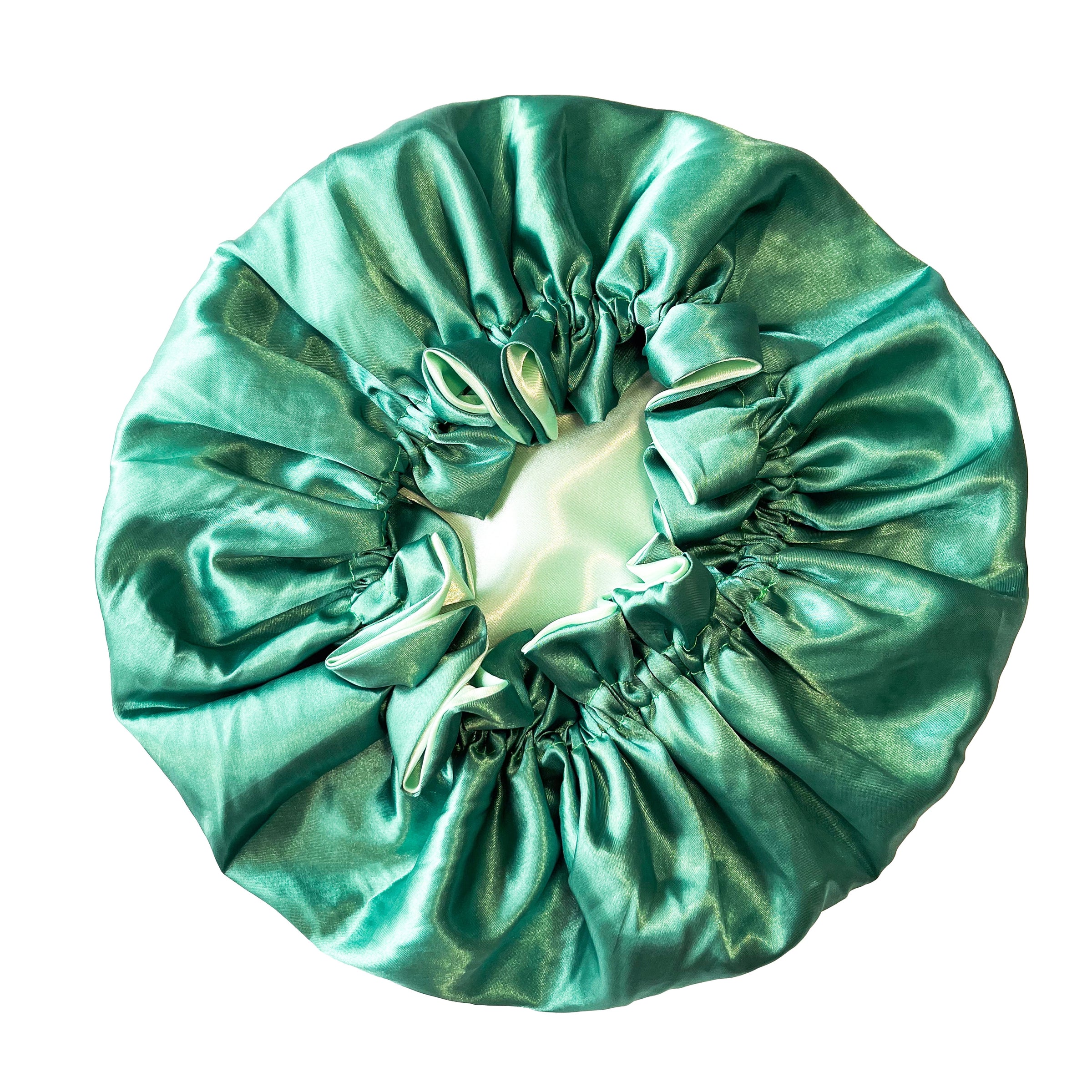 green satin hair bonnet on a white background