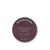 A round tin of NAK HAIR Niacinamide Rescue Hair Masque in a dusty mauve-brown shade, shown on a clean white background.