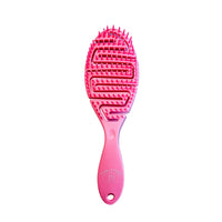 Pink curly  hairbrush on a white background