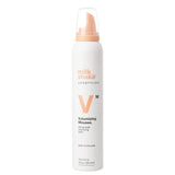 Milk Shake Volumizing Mousse bottle on a white background
